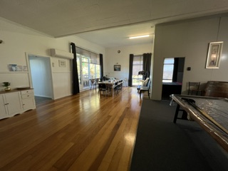 Timber floored living and dining area with pool table and large dining setting - 5 Bedroom Apartment, Longhorn Ranch Apartments Orbost
