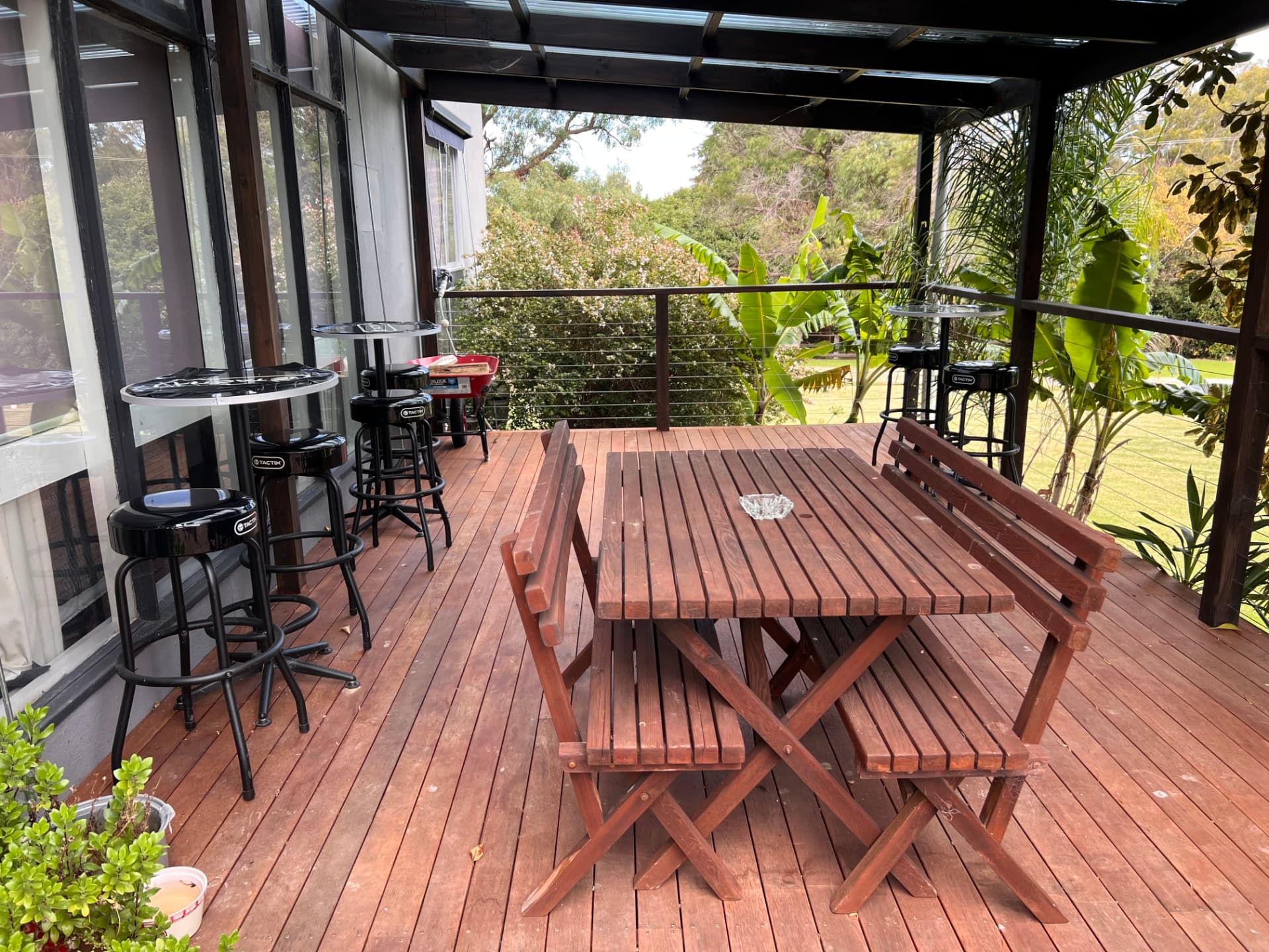 Undercover outdoor dining area looking out to the garden and lawn