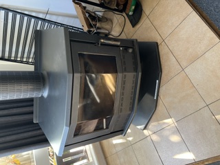 Large Coonara combustion wood heater in the main lounge - 5 Bedroom Apartment, Longhorn Ranch Apartments Orbost