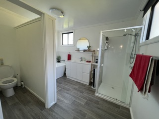 Bathroom with bathtub, shower, vanity and separate toilet - 5 Bedroom Apartment, Longhorn Ranch Apartments Orbost